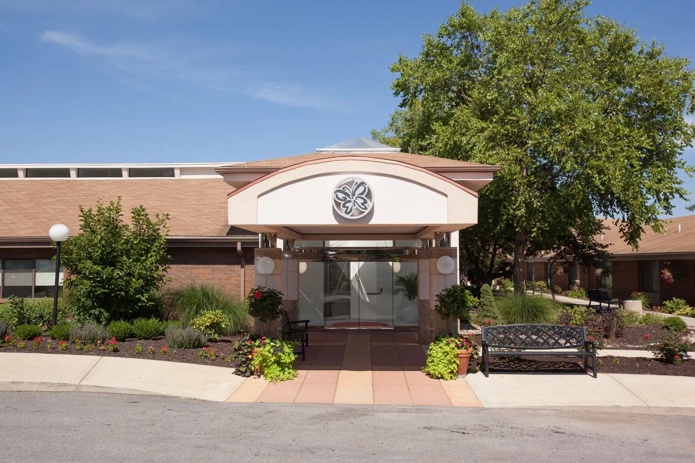 Entrance of Delmar Gardens of Lenexa with landscaped area
