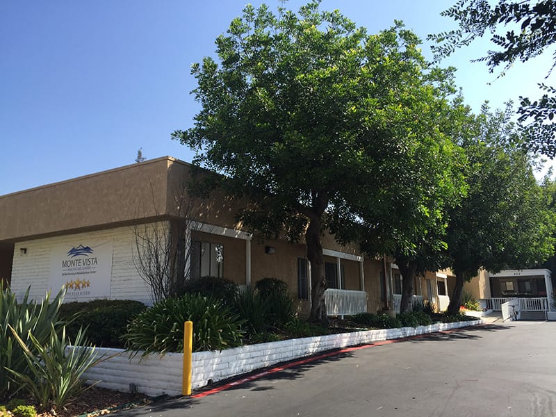 Exterior view of Monte Vista Care Center with landscaping