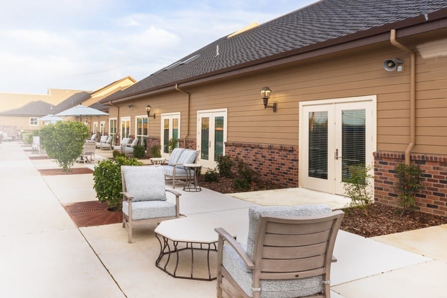 Patio area with seating and well-maintained landscaping
