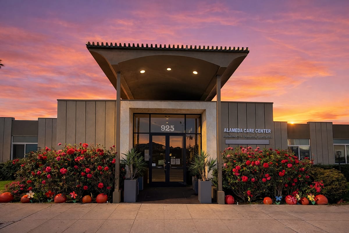 Exterior of Alameda Care Center at sunset with flowers