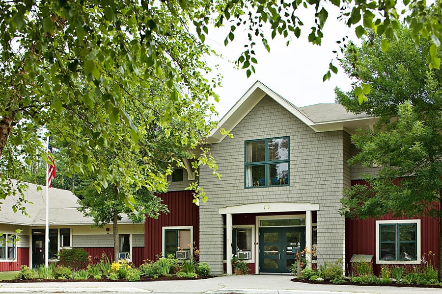 Exterior view of RiverRidge Center with trees around