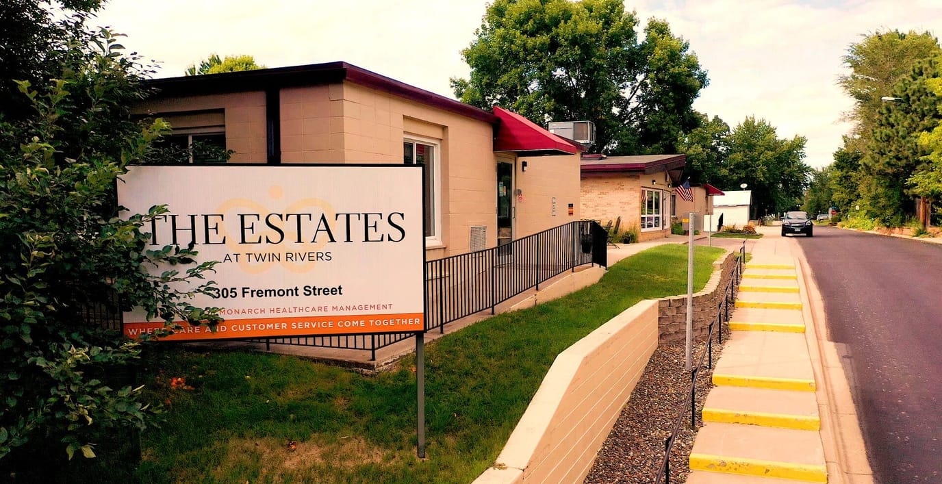 Exterior view of The Estates at Twin Rivers sign and building