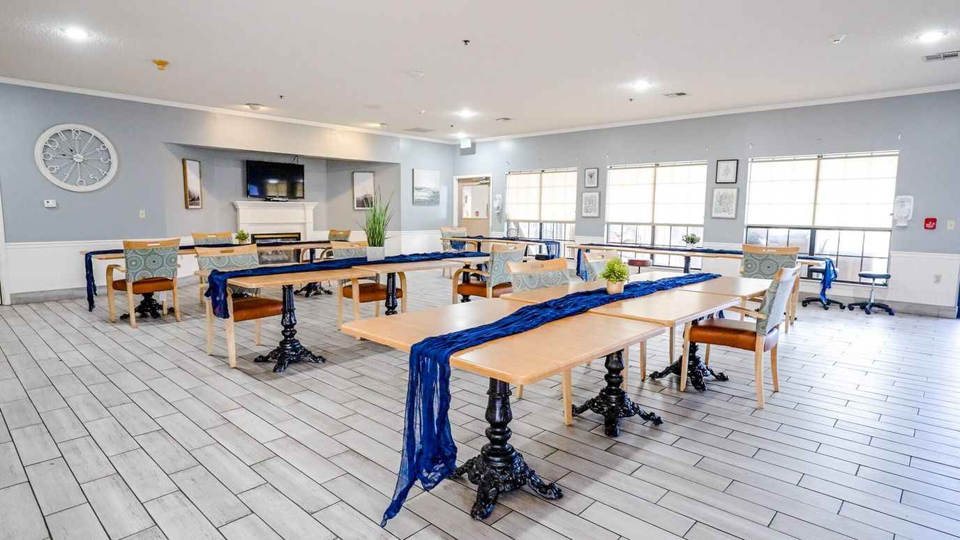 Bright common area with tables and chairs