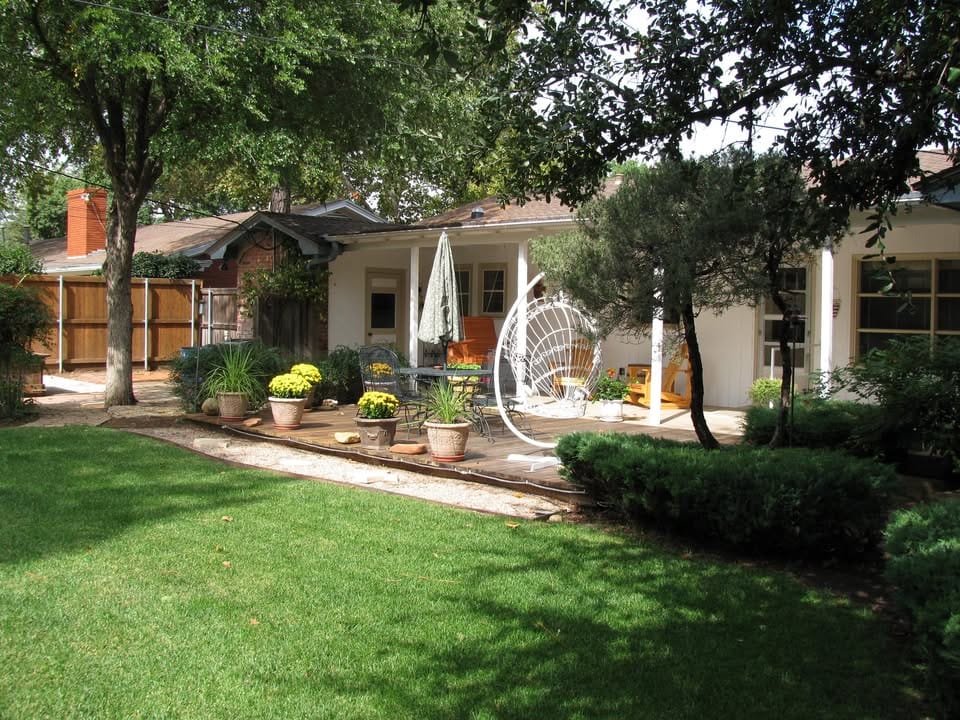 Outdoor patio area with seating and garden