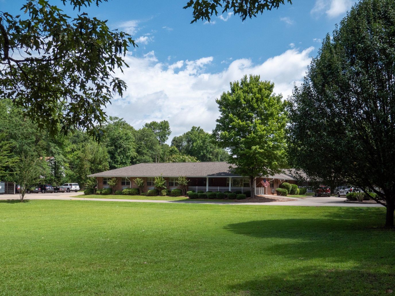 Exterior view of Brown Nursing Home surrounded by greenery
