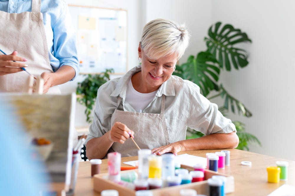 Residents engaged in a productive art activity