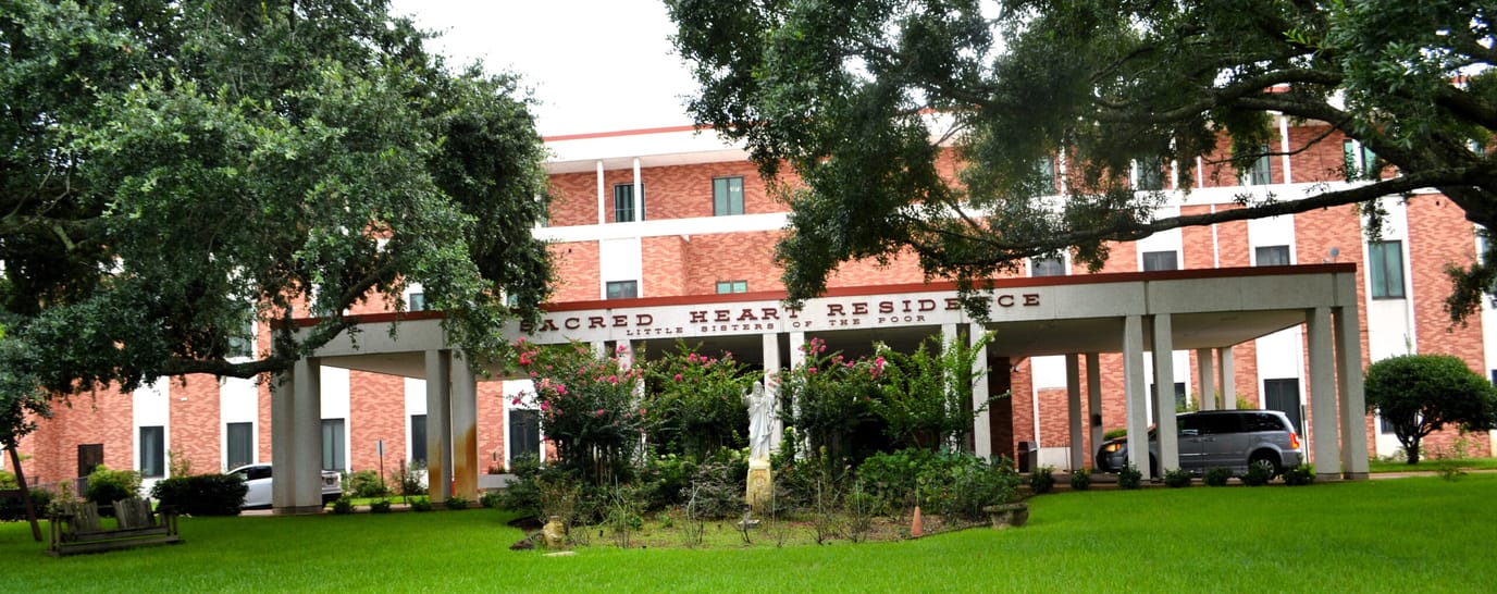 Exterior view of Sacred Heart Residence with landscaping