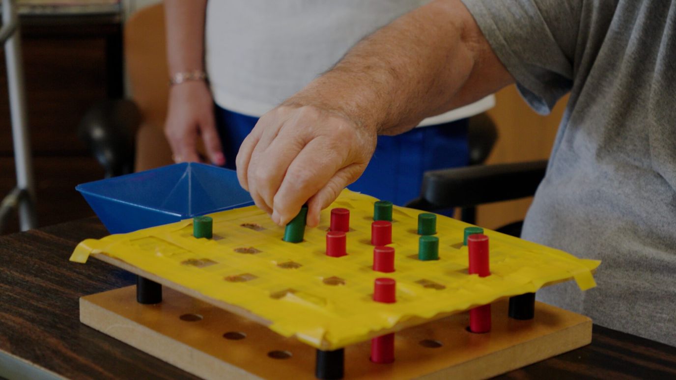 Resident participating in a game activity