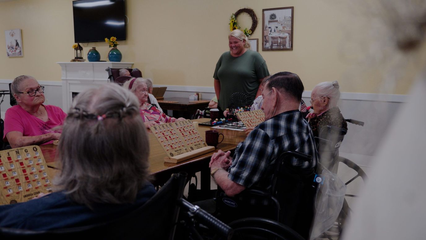 Residents participating in a game activity in a common area