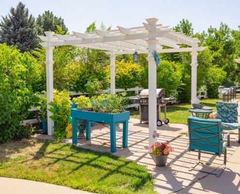 Outdoor patio with garden and seating area