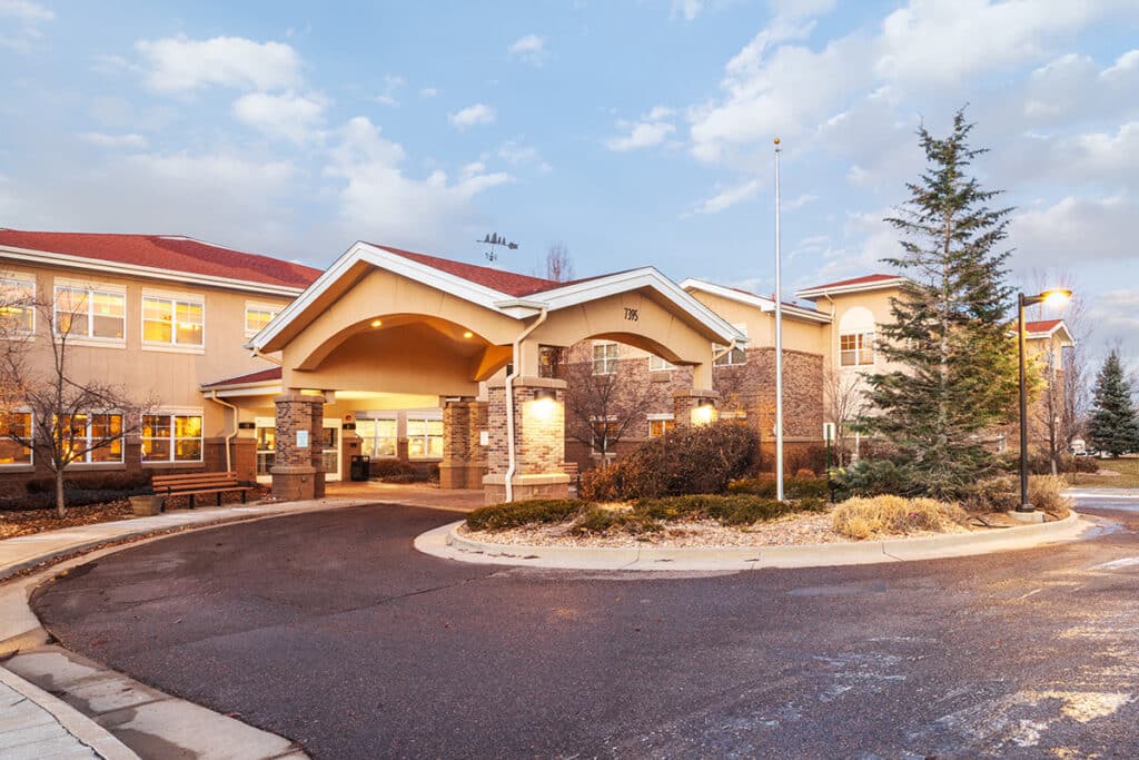 Front entrance of a senior living facility at dusk