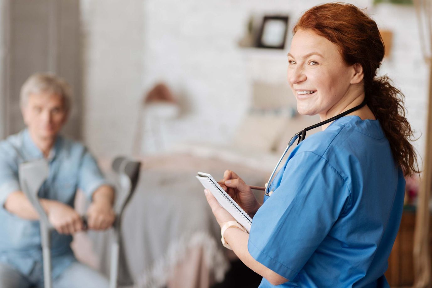 Staff member interacting with a resident in a private room