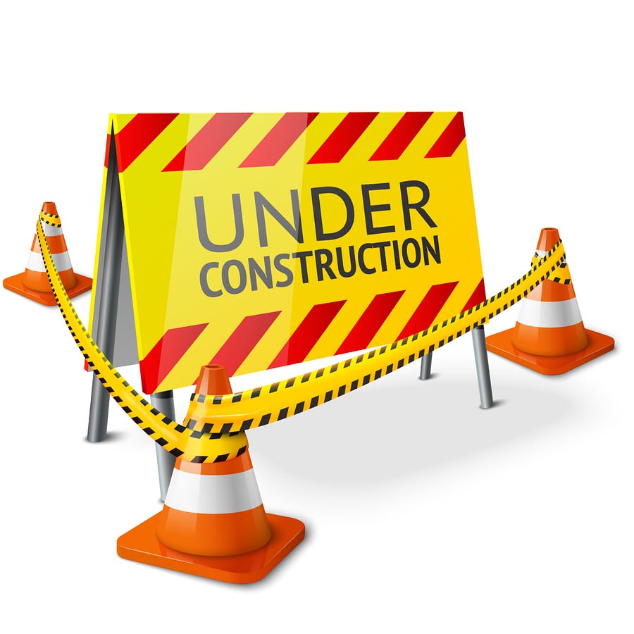Construction sign with cones and barriers