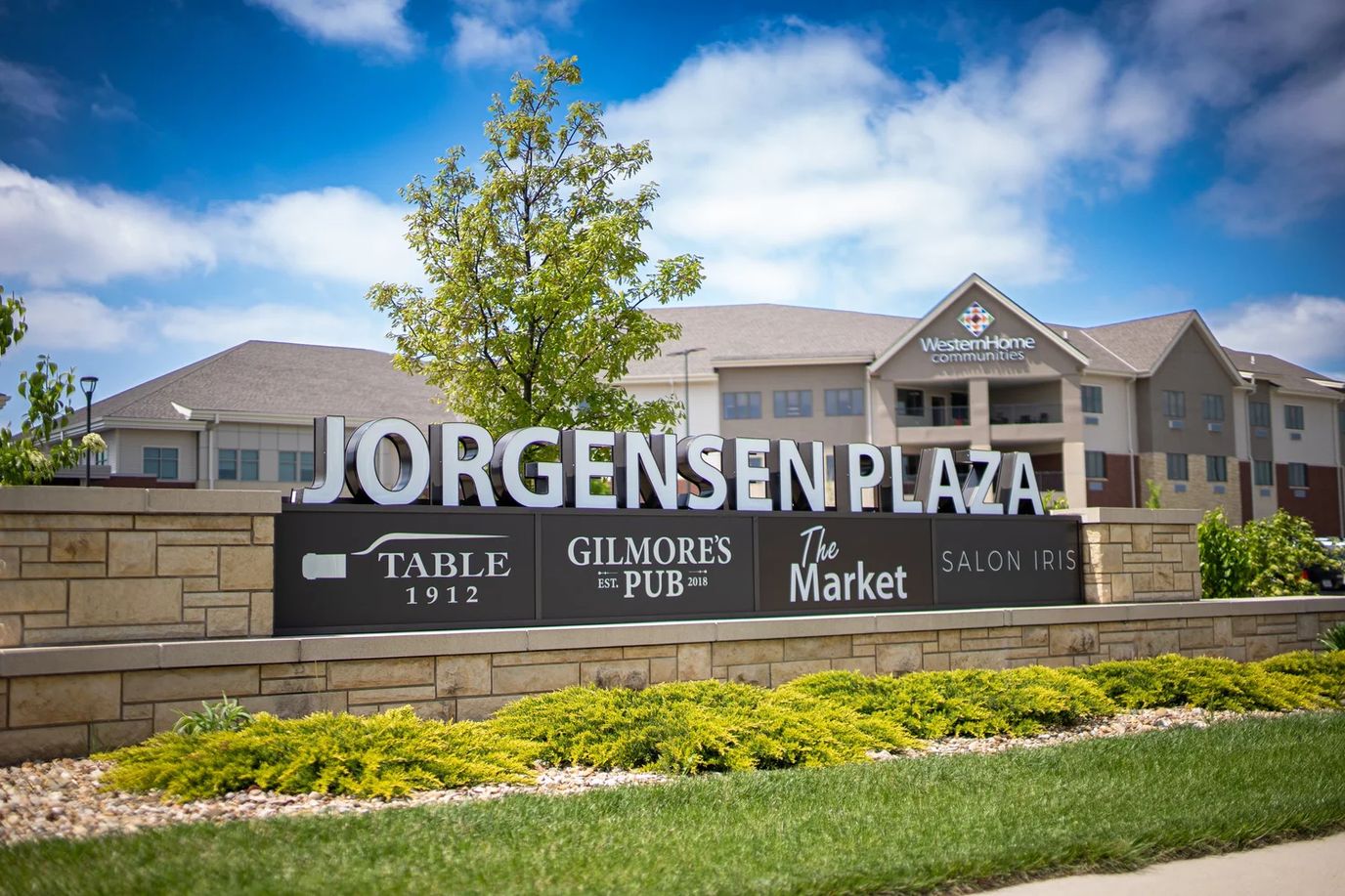Exterior sign at Jorgensen Plaza with blue sky