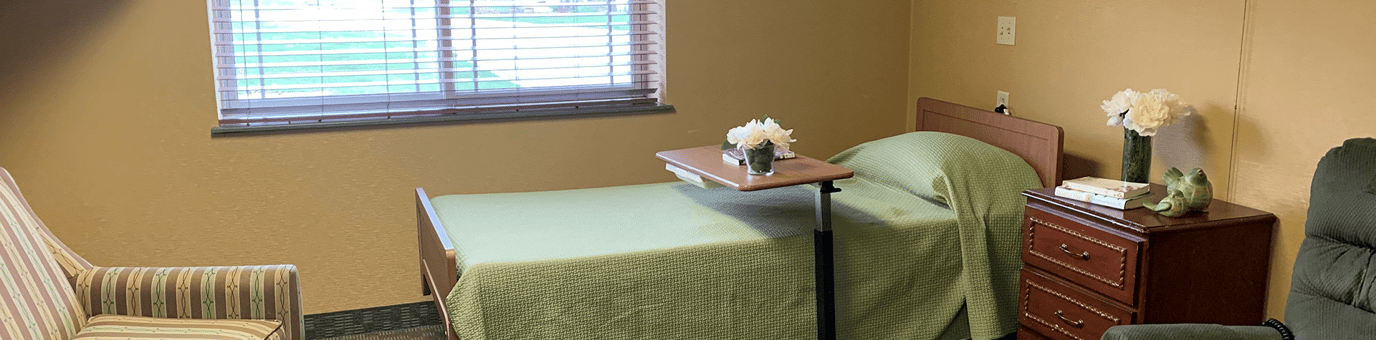 Private resident room with bed and furnishings