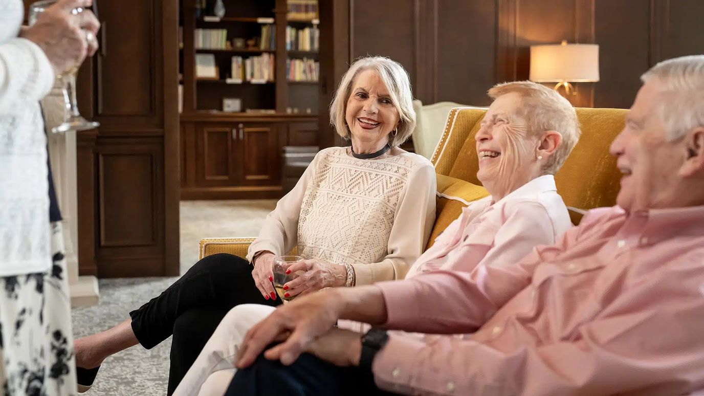 Residents enjoying a cheerful moment in a common area