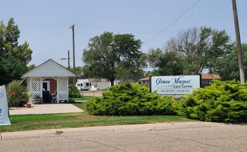 Exterior view of Grace Manor Care Center with signage