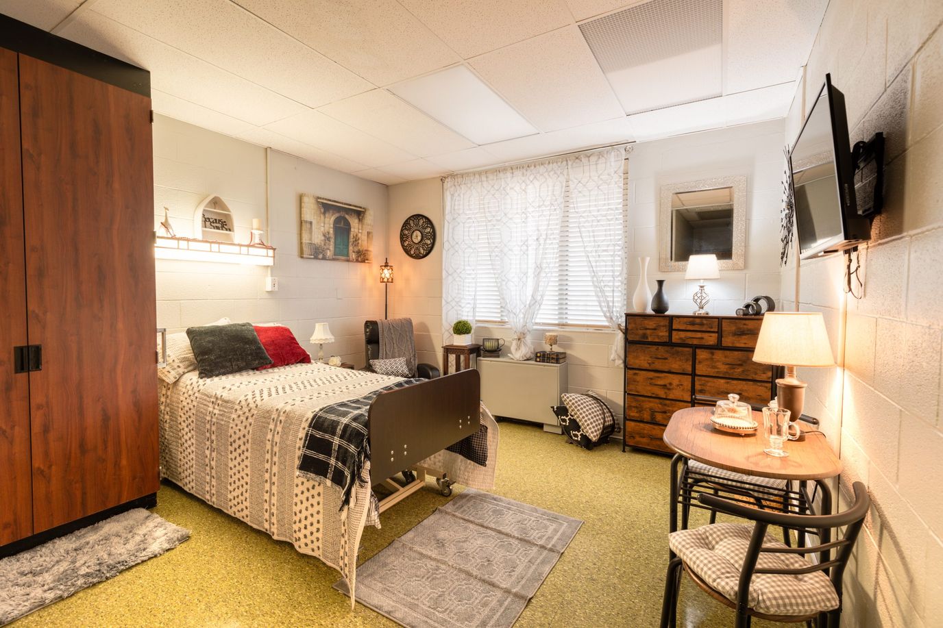 Cozy resident room with bed, decorations, and furnishings