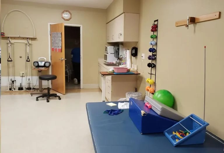 Therapy room with equipment and supplies