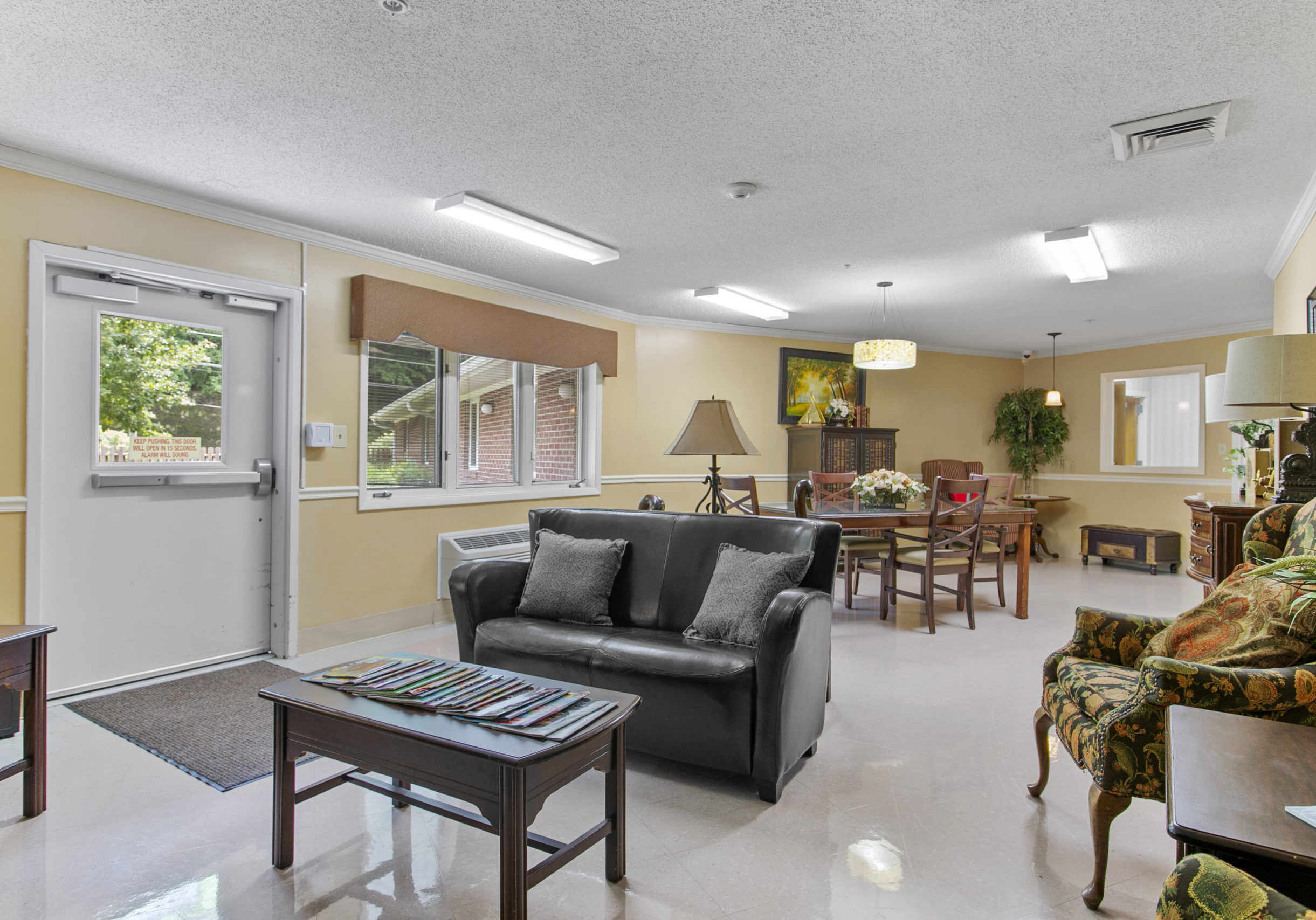 Bright common area with seating and dining table
