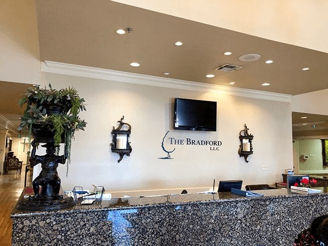 Lobby reception area with a decorative front desk
