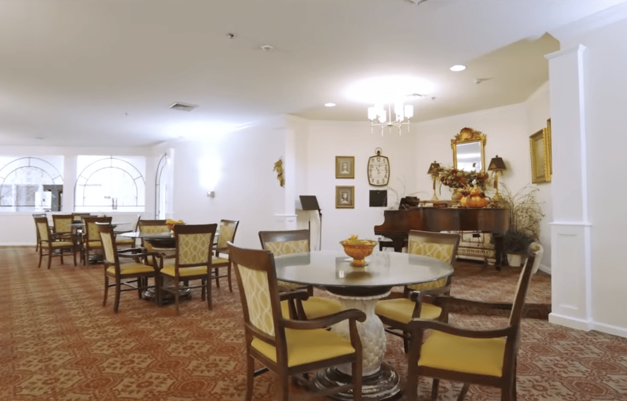 Interior of a cozy common area with tables and chairs