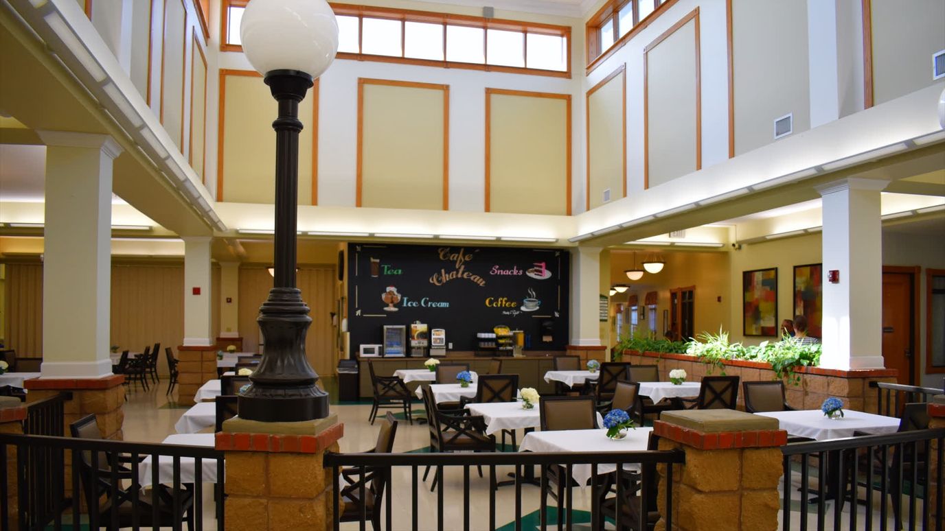 Interior view of a dining area with tables and chairs
