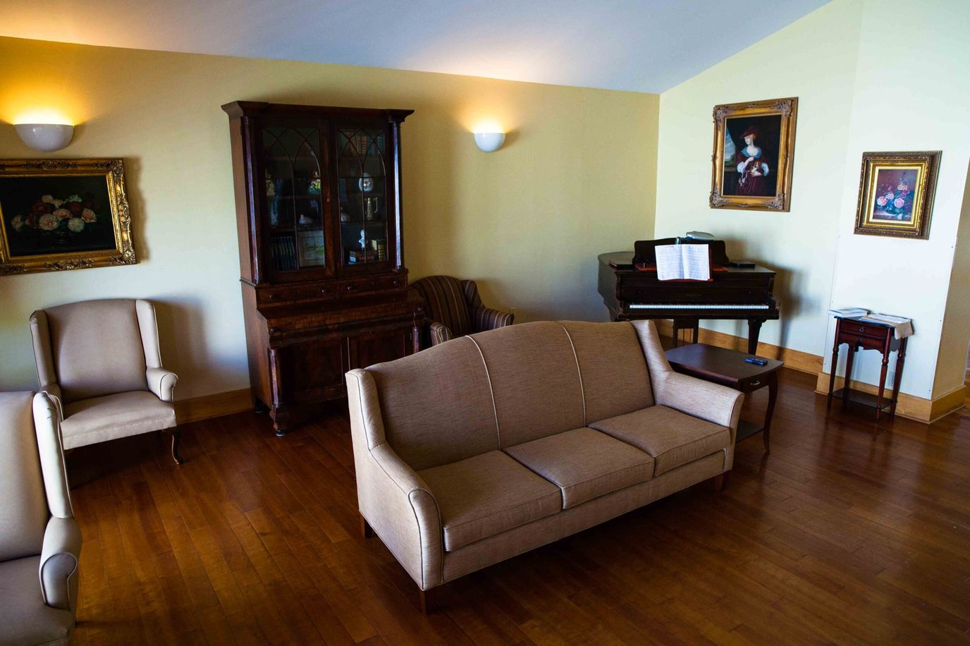 Cozy interior lounge area with piano and seating