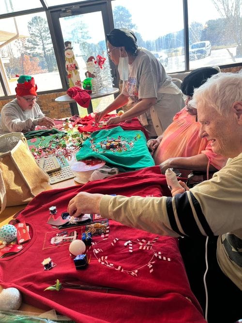 Claiborne Rehabilitation, Nursing Home in Homer, LA — Seniors crafting holiday decorations in a festive room