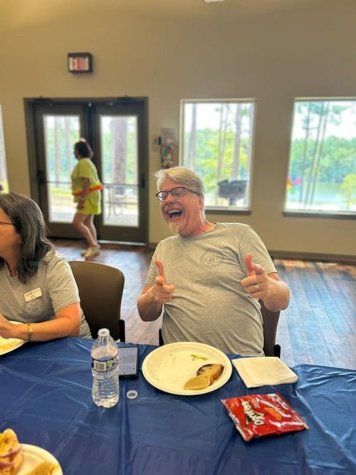 Princeton Place-Ruston, Nursing Home in Ruston, LA — Laughing resident at a dining table with food