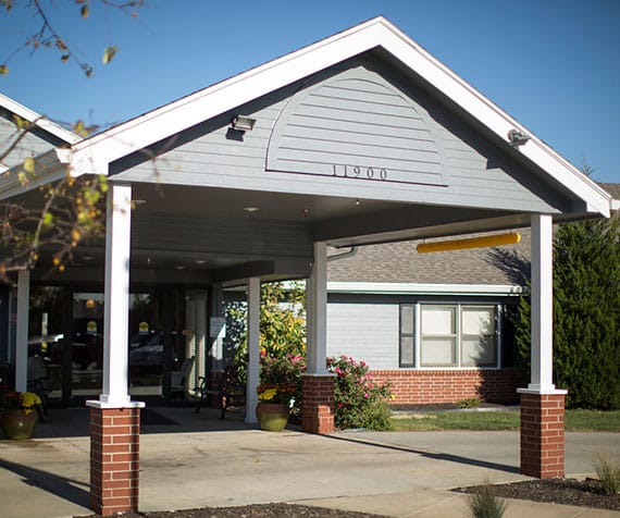 Entrance of a senior living facility with porch
