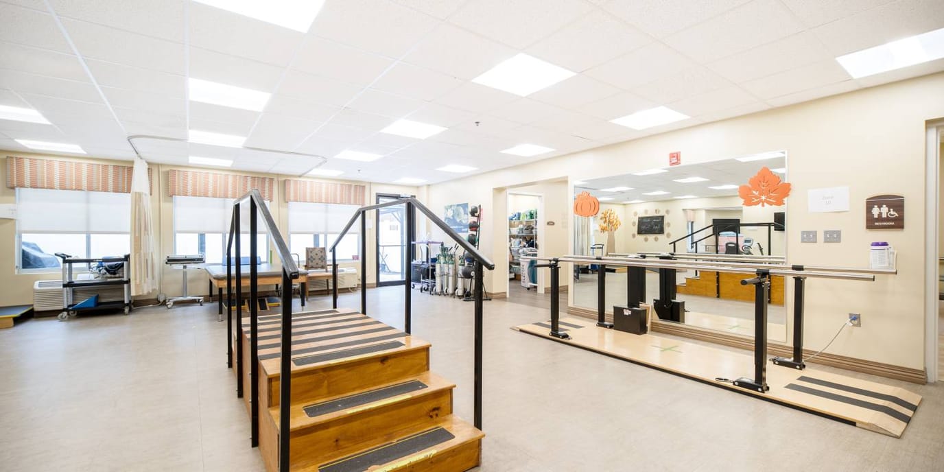 Interior view of a therapy room with steps and equipment
