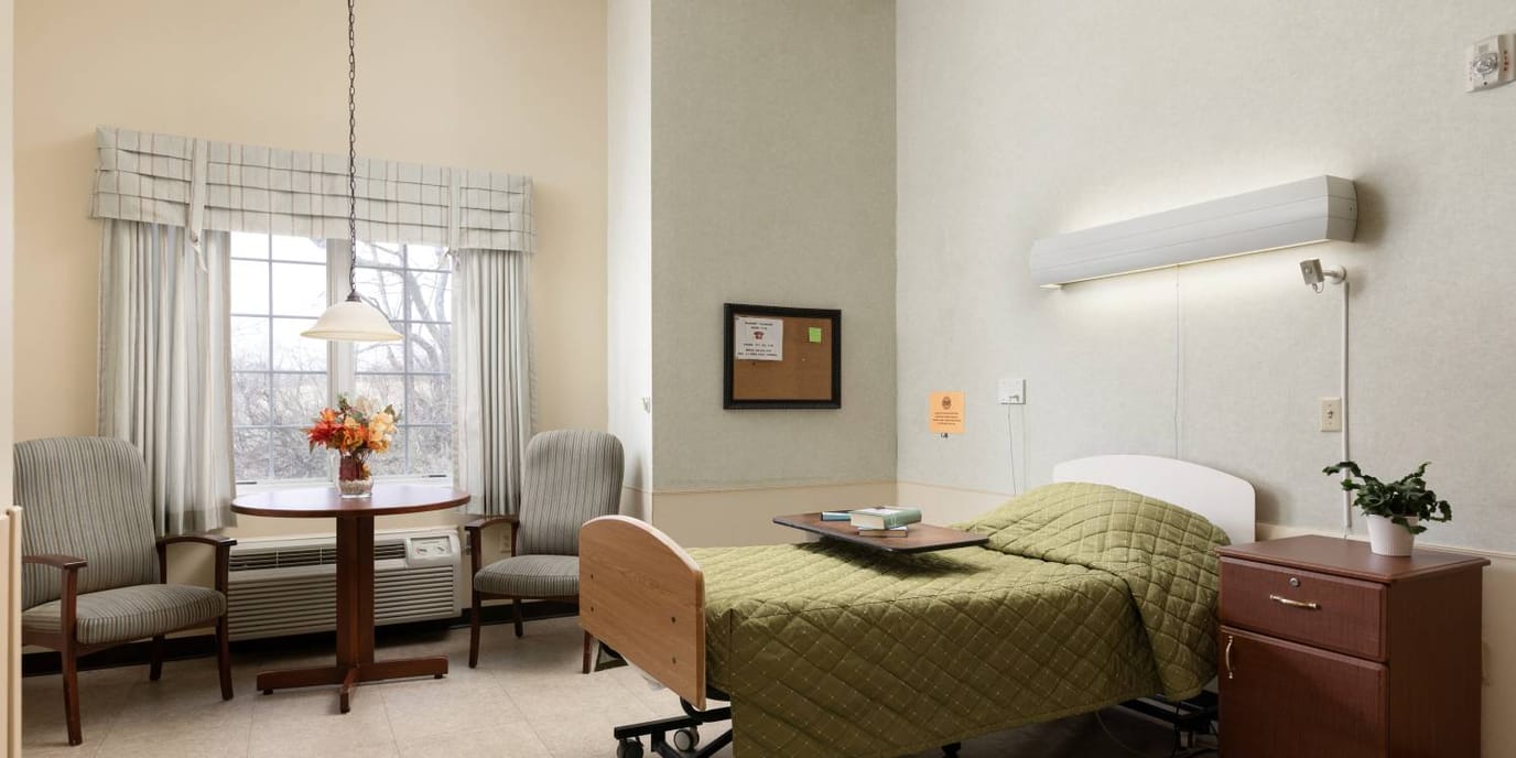 Private resident room with furniture and window view