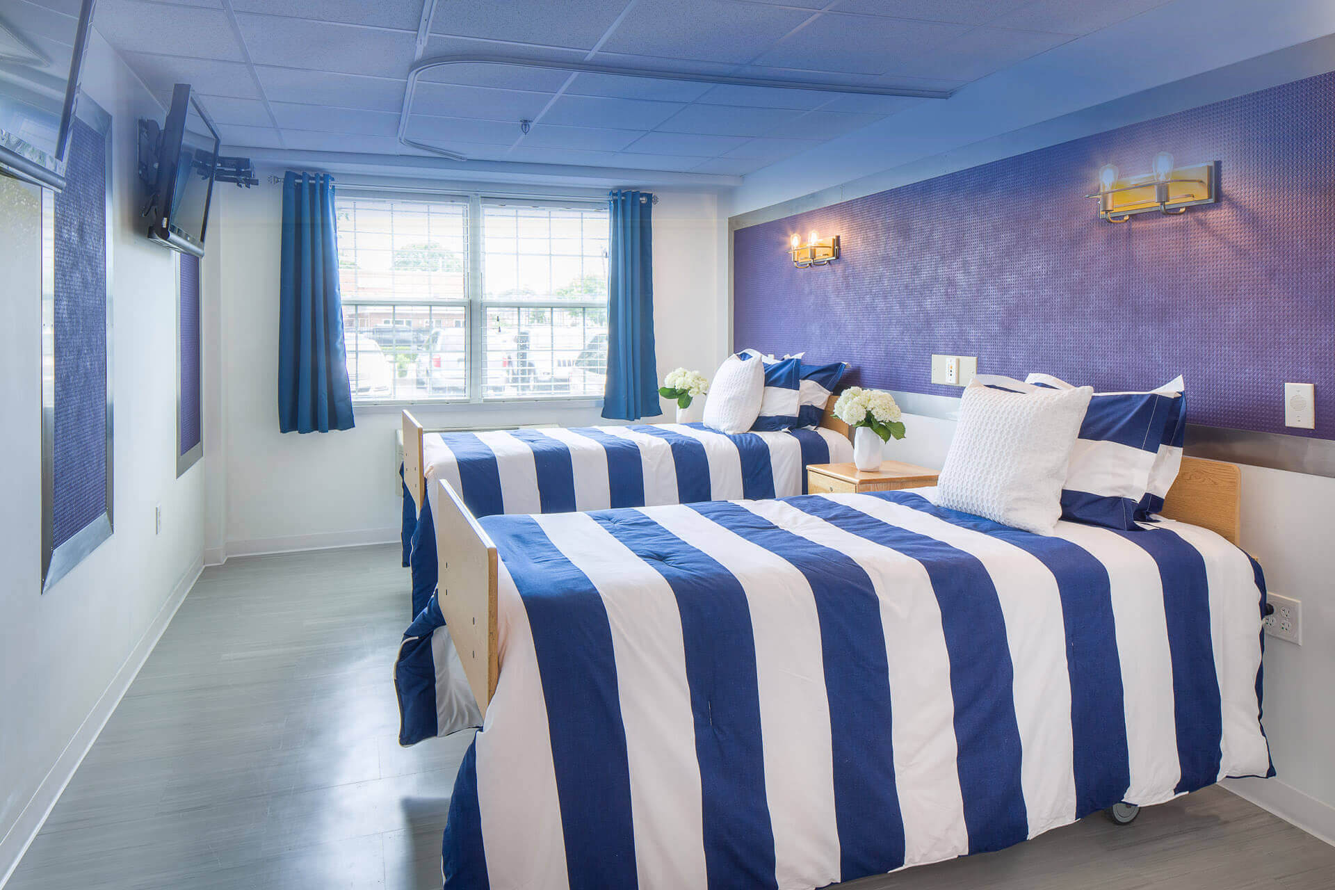 Interior view of a shared resident bedroom with two beds
