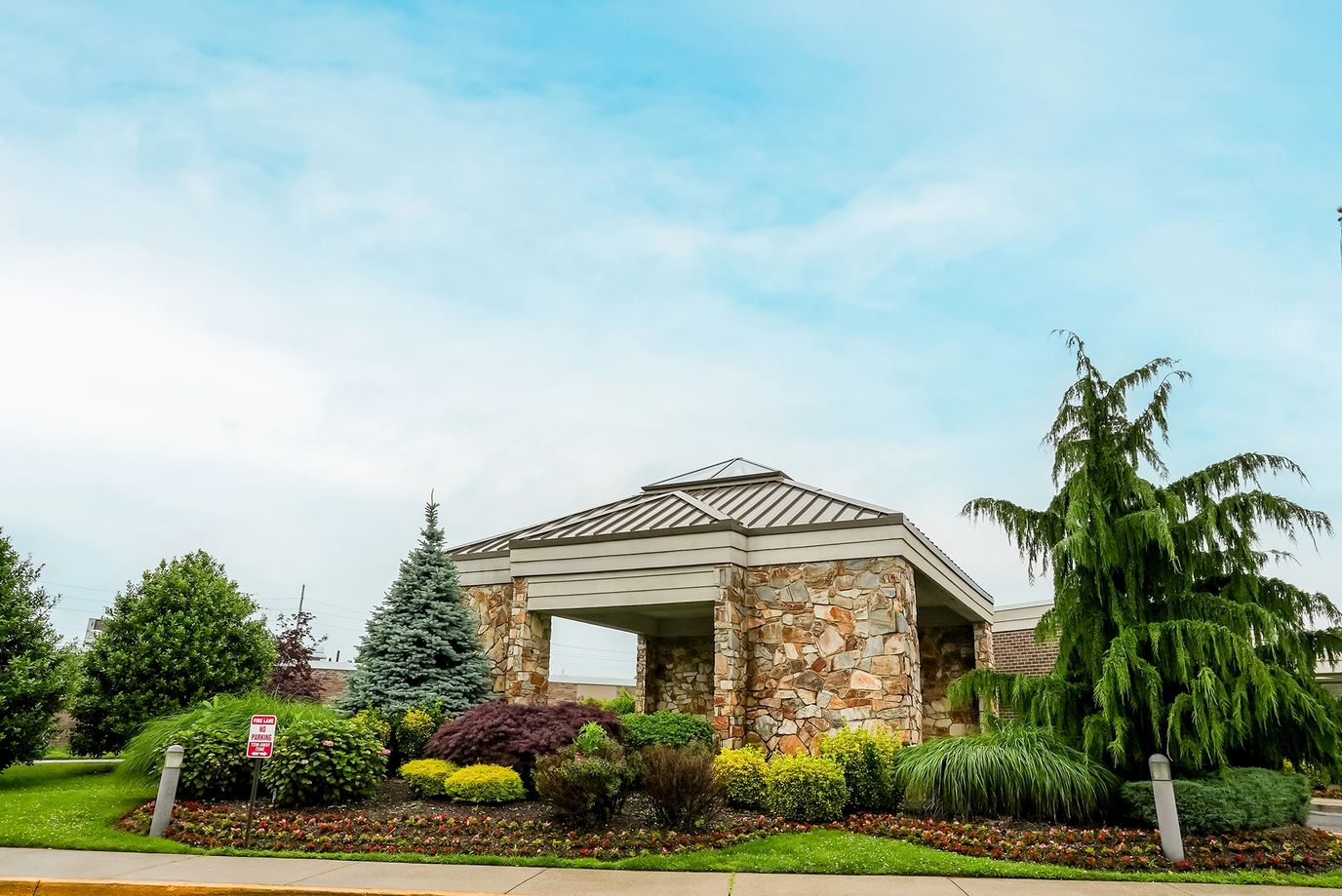 Exterior view of a well-landscaped assisted living facility