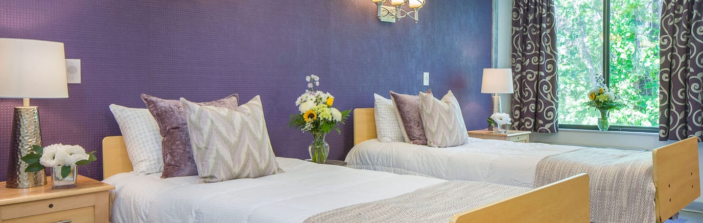 Brightly decorated shared bedroom with flowers
