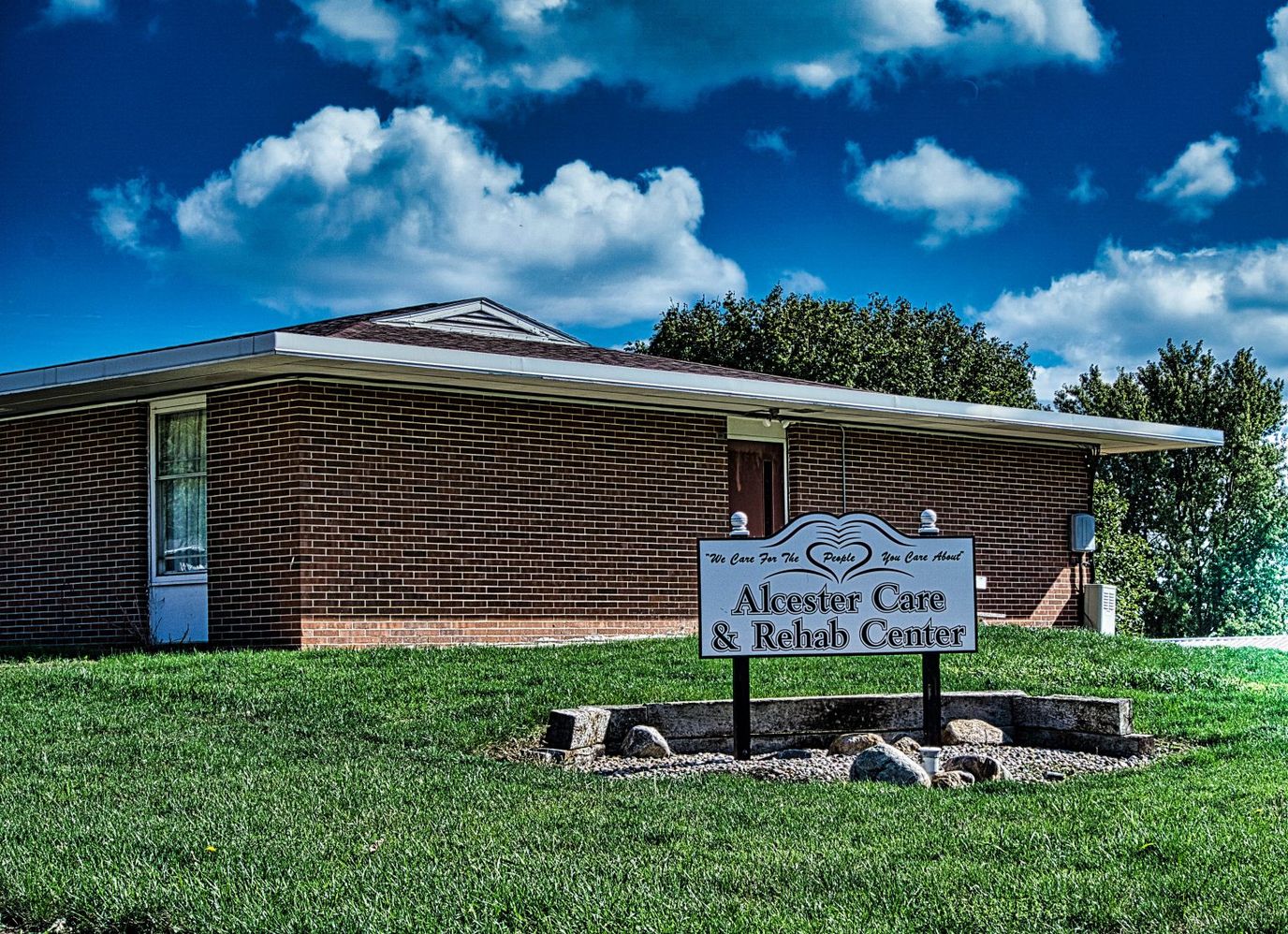 Exterior view of a senior care facility with signage