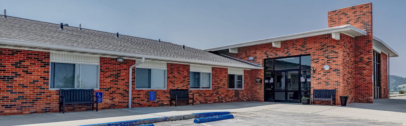 Exterior view of a brick senior living facility