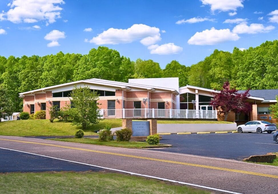 Facility building exterior with a landscaped front