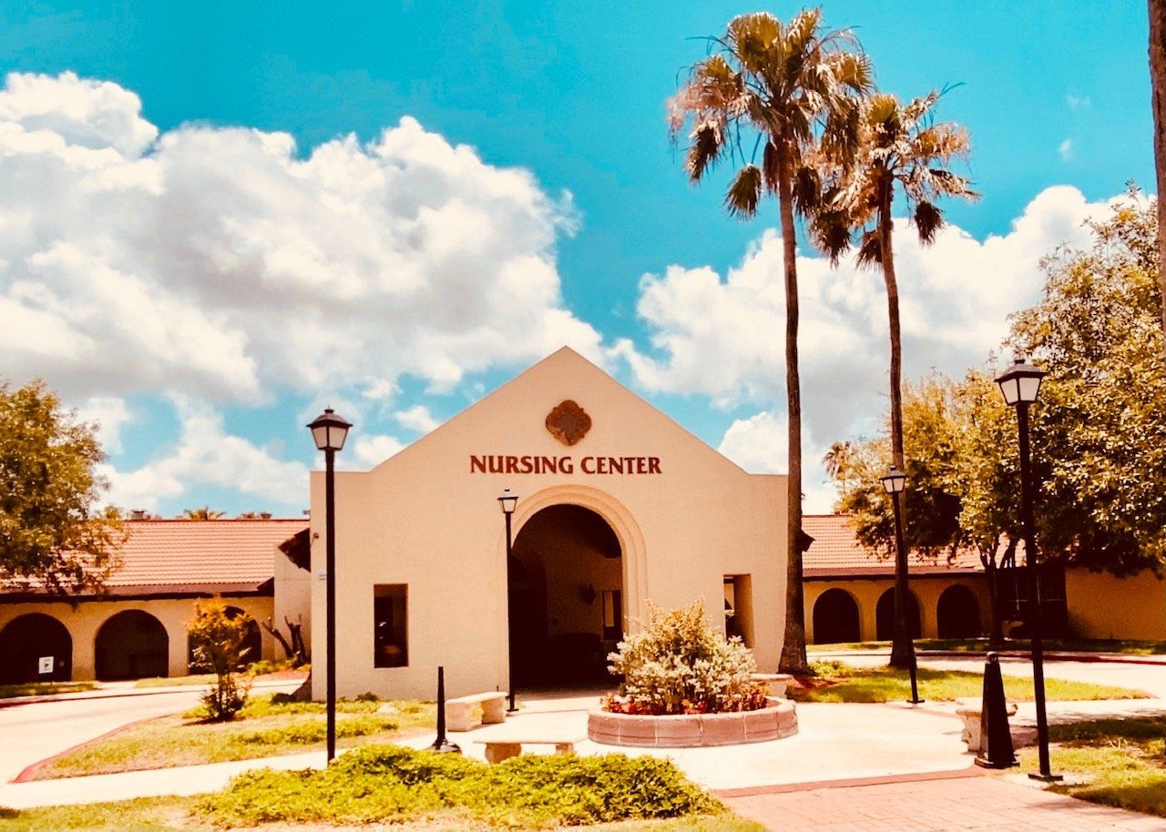 Exterior view of the nursing center with palm trees