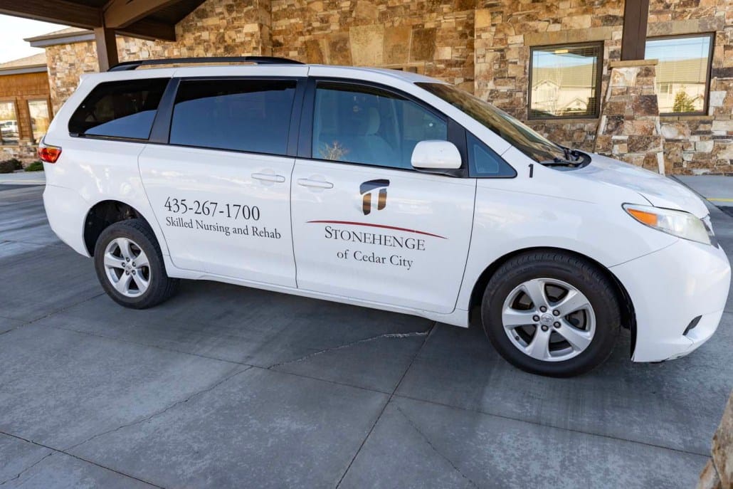 Facility transport van parked outside the building