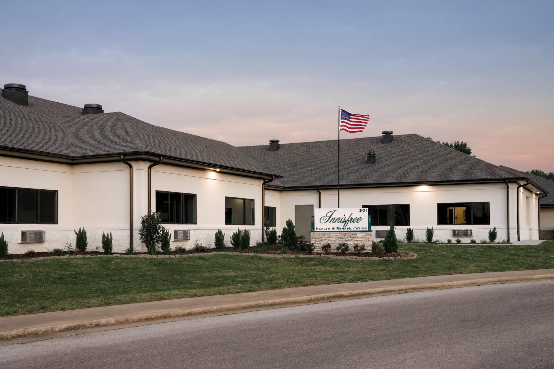 Exterior view of a senior living facility with landscaping