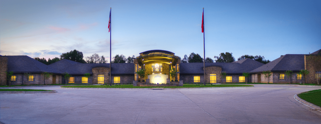 Exterior view of a nursing home facility at dusk