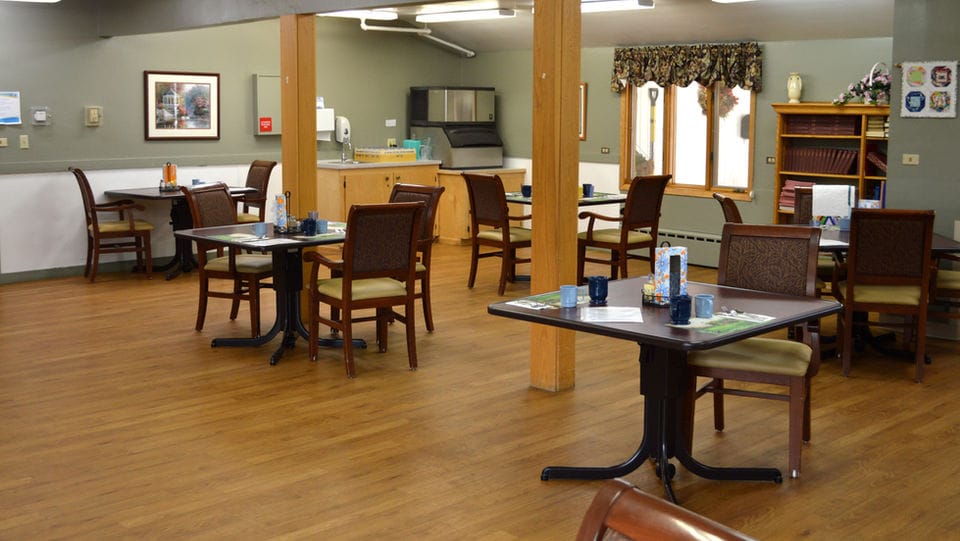 Dining area with tables and chairs in a light environment