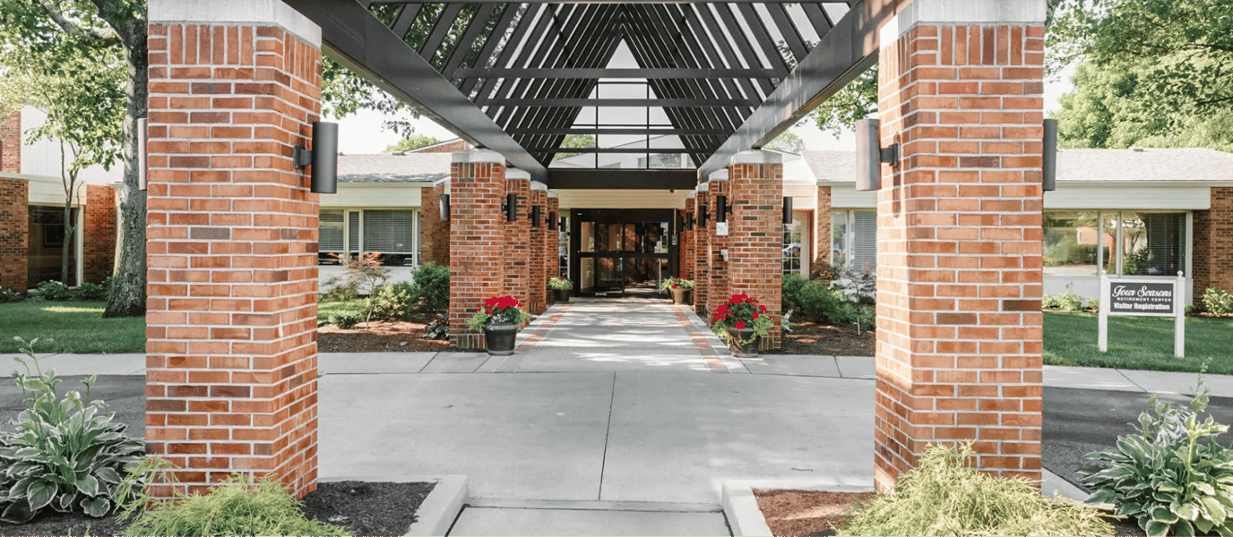 Entrance of a senior care facility with landscaped path
