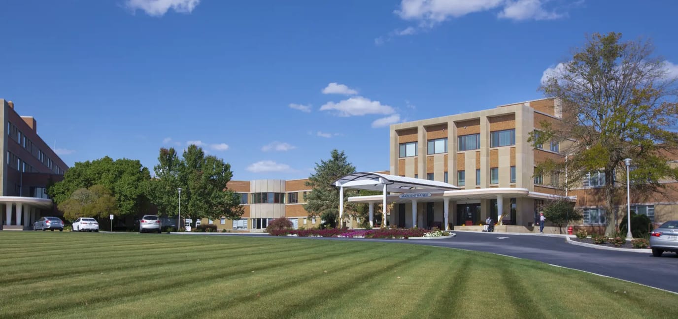 View of the assisted living facility entrance and landscaping