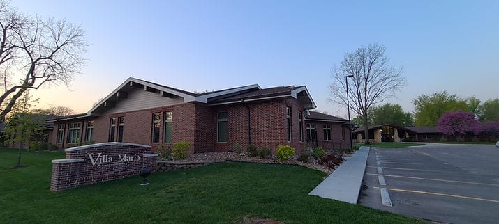 Exterior view of Villa Maria facility at sunset