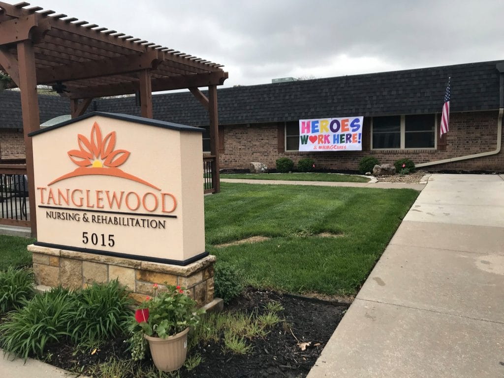 Exterior of Tanglewood Nursing and Rehabilitation with a sign