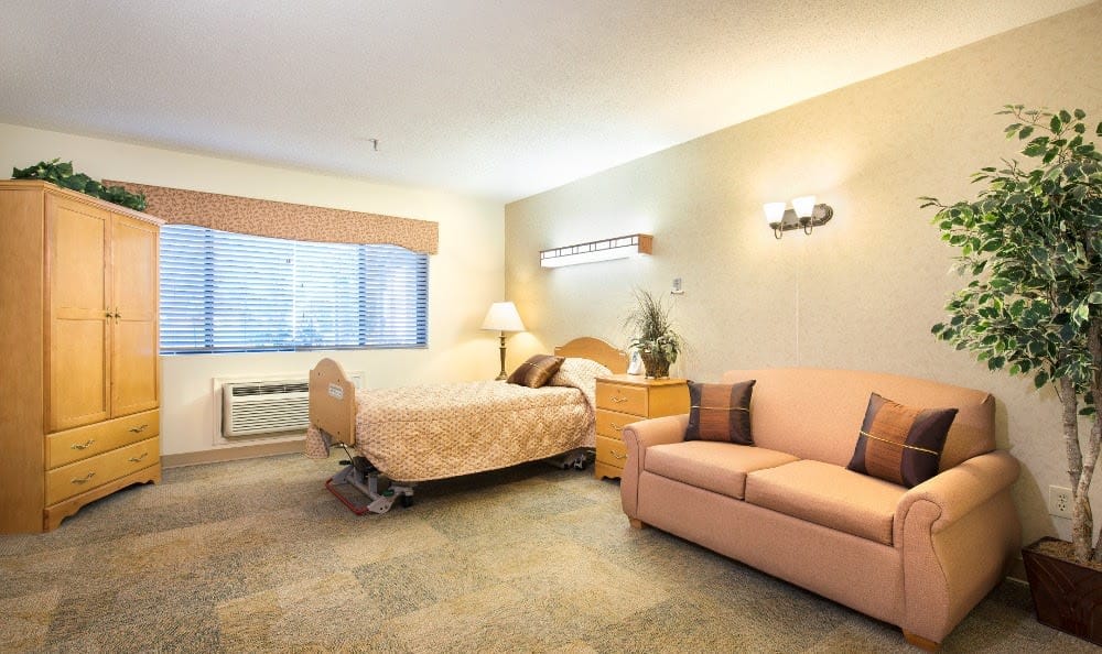 Cozy resident room with bed and seating area