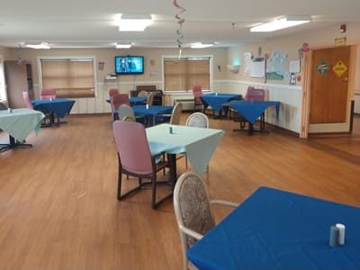 Common area with tables and chairs in a dining space